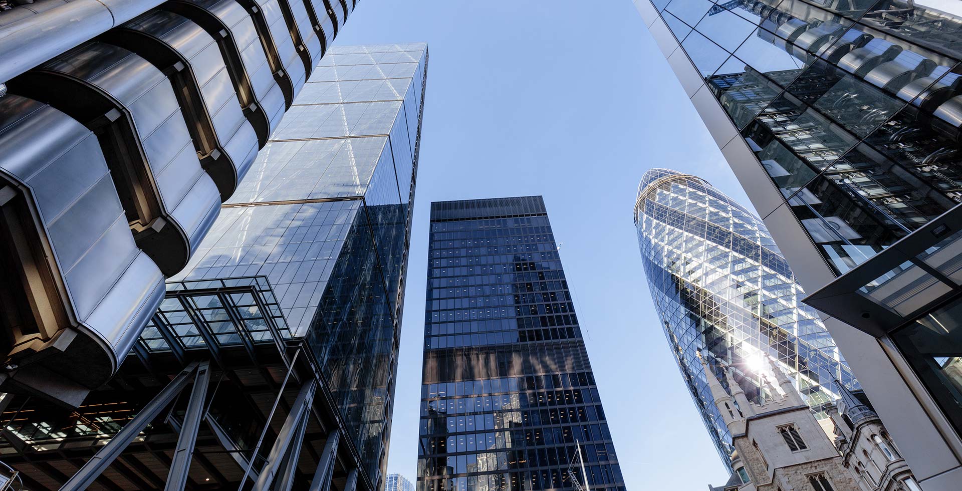 UK, London, low angle view of modern office buildings in the city including the Cheesegrater, Aviva tower, Scalpel, Gherkin and Lloyds of London